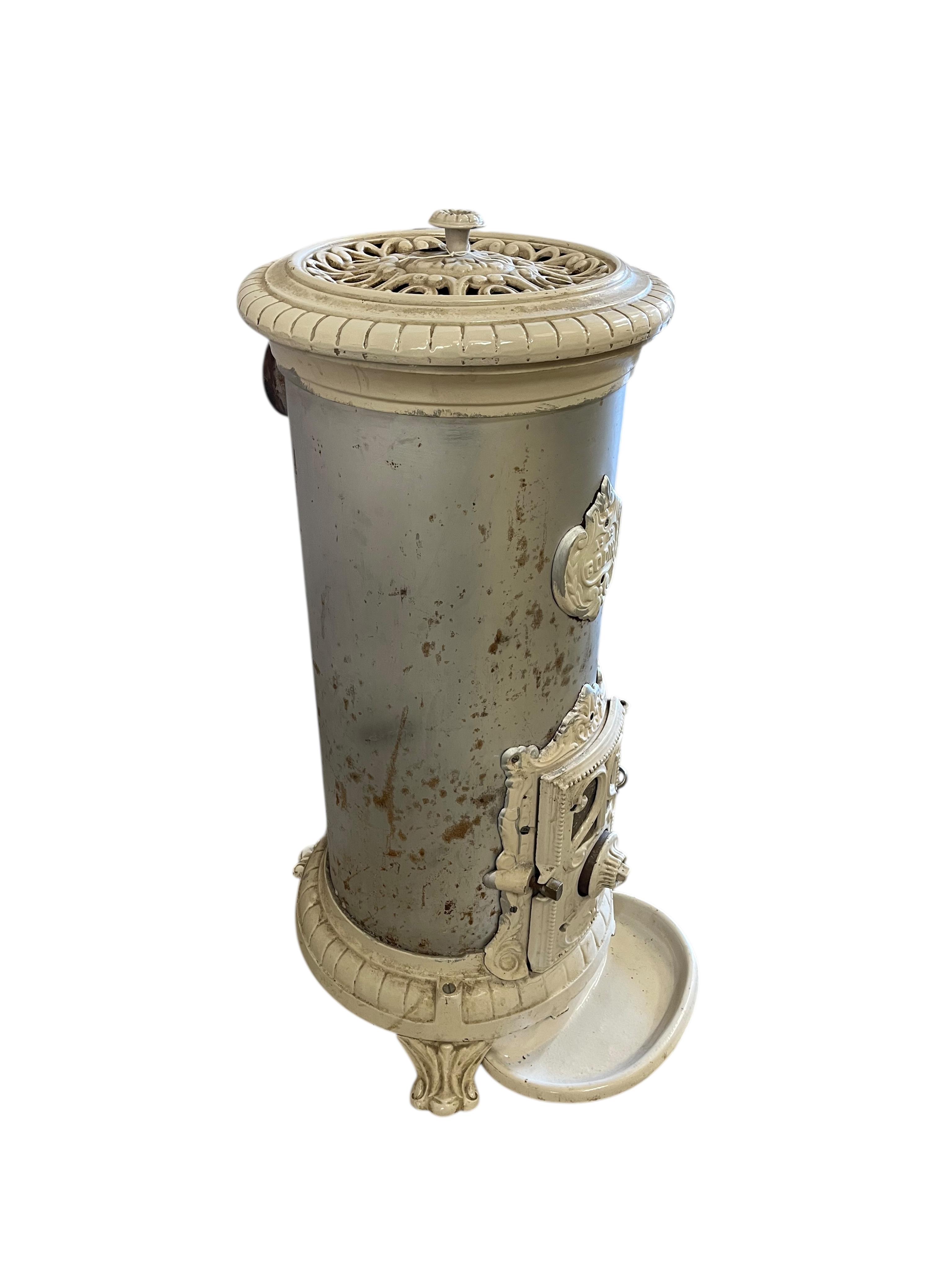 A 19th century French Godin cast iron stove, height 96cm